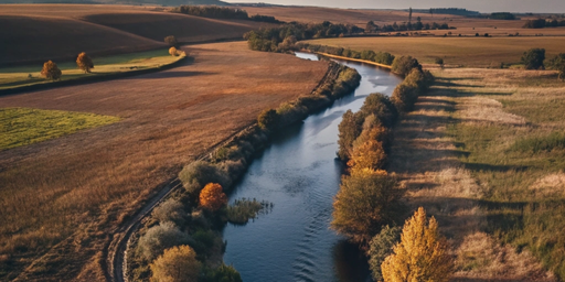 a river in the middle of two fields